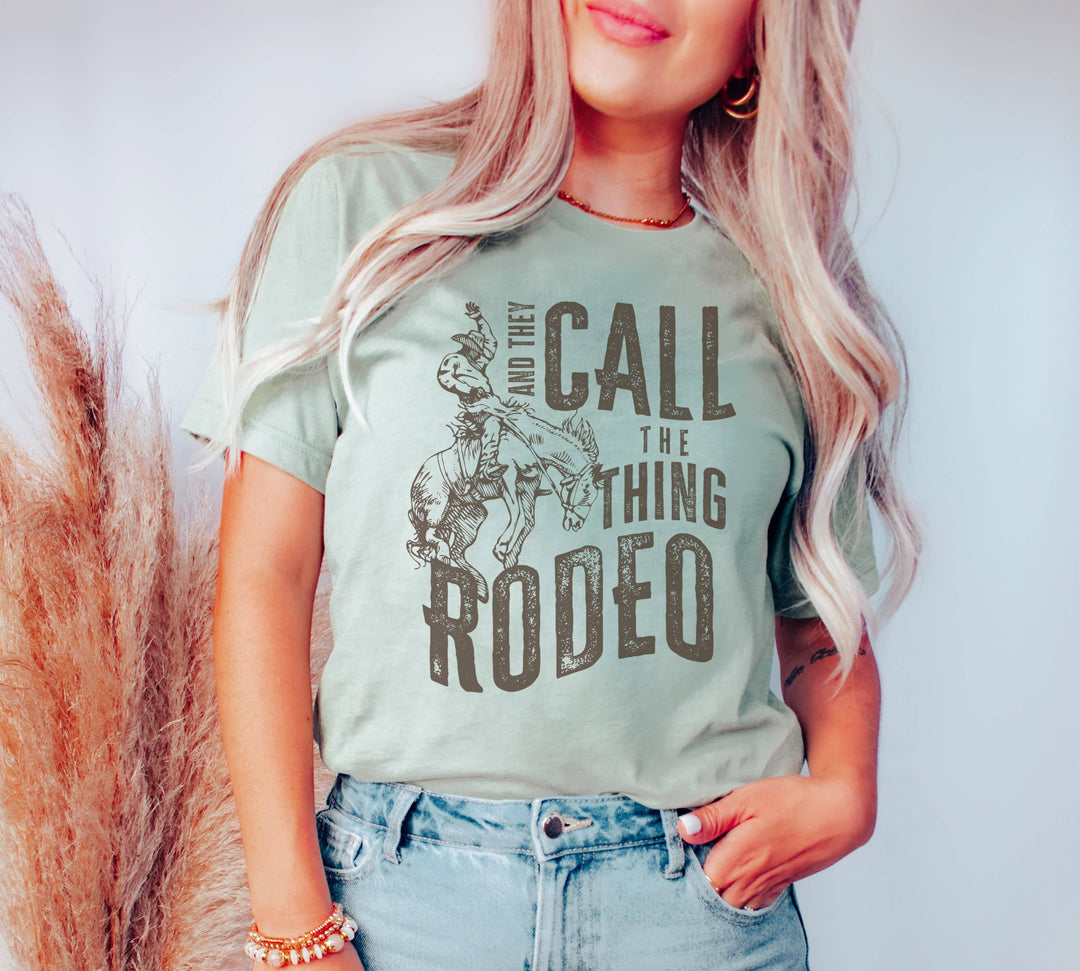 Amy Anne Apparel Women's They Call The Thing Rodeo T-Shirt - Heather Dust