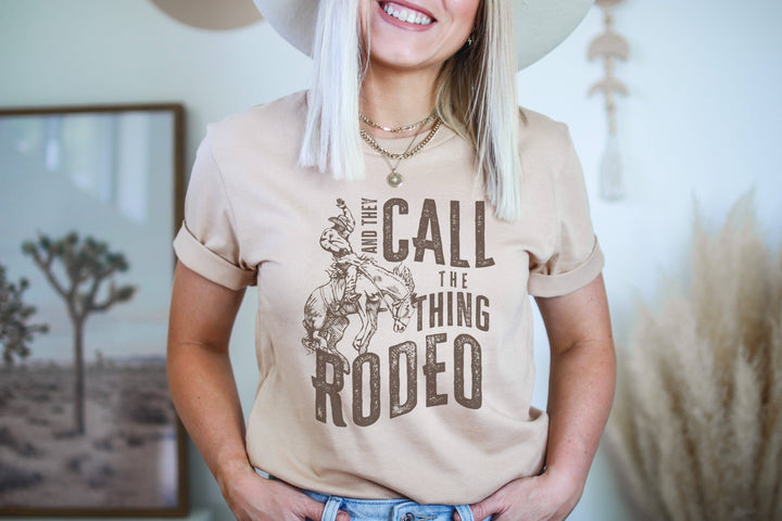 Amy Anne Apparel Women's They Call The Thing Rodeo T-Shirt - Heather Dust
